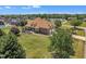 Expansive home with a brick exterior, manicured lawn, and a lakeside view in a serene community at 296 Shoreline Dr, Princeton, NC 27569