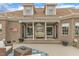 Brick home with covered patio, swing, string lights, and outdoor seating at 296 Shoreline Dr, Princeton, NC 27569
