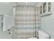 Bright bathroom with toilet, shower curtain, and towel rack at 296 Shoreline Dr, Princeton, NC 27569