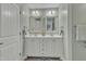 Bathroom featuring a double vanity with framed mirrors and soft lighting at 296 Shoreline Dr, Princeton, NC 27569