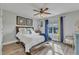 Cozy bedroom with hardwood floors, large windows, and comfortable bedding at 296 Shoreline Dr, Princeton, NC 27569