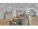 Bonus room with TV, sofa, ottoman, exercise bike, and desk area at 296 Shoreline Dr, Princeton, NC 27569