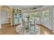 Charming breakfast nook with bay windows, decorative chandelier, and a view of the outdoors at 296 Shoreline Dr, Princeton, NC 27569