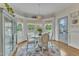 Bright breakfast nook with a bay window, chandelier, and elegant decor, perfect for casual meals at 296 Shoreline Dr, Princeton, NC 27569