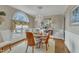 Elegant dining room featuring a chandelier, decorative wallpaper, and a large window at 296 Shoreline Dr, Princeton, NC 27569
