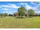 Charming home with well-maintained lawn and mature trees, providing ample shade at 296 Shoreline Dr, Princeton, NC 27569