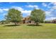 Charming home with mature trees and lush green lawn at 296 Shoreline Dr, Princeton, NC 27569