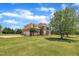 Spacious brick home featuring a well-manicured lawn and mature trees at 296 Shoreline Dr, Princeton, NC 27569