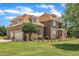 Spacious brick home with a three-car garage and beautifully landscaped front yard at 296 Shoreline Dr, Princeton, NC 27569