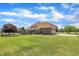 Expansive lawn and mature trees surround this charming home with a brick exterior at 296 Shoreline Dr, Princeton, NC 27569