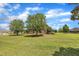 Well-maintained lawn with mature trees surround the home at 296 Shoreline Dr, Princeton, NC 27569