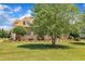 Brick home featuring manicured landscaping and mature trees at 296 Shoreline Dr, Princeton, NC 27569