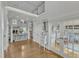 Grand foyer with hardwood floors, a decorative staircase, and french doors leading to another room at 296 Shoreline Dr, Princeton, NC 27569