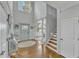 Elegant foyer featuring a soaring ceiling, hardwood floors, and a decorative chandelier at 296 Shoreline Dr, Princeton, NC 27569