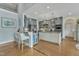 Open-concept kitchen features an island, granite countertops, stainless steel appliances, and custom cabinets at 296 Shoreline Dr, Princeton, NC 27569