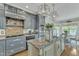 This kitchen has granite countertops, custom cabinets, stainless steel appliances, and a breakfast area at 296 Shoreline Dr, Princeton, NC 27569