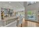Bright kitchen featuring granite counters, custom cabinets, and an adjacent breakfast nook with a large window at 296 Shoreline Dr, Princeton, NC 27569