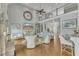 Spacious living room with hardwood floors, large windows, high ceiling, and an adjacent open kitchen at 296 Shoreline Dr, Princeton, NC 27569