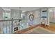 Open-concept living area showcasing fireplace and vaulted ceiling with oversized clock at 296 Shoreline Dr, Princeton, NC 27569