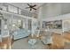 Open-concept living room with hardwood floors, adjacent to the kitchen, offering a great flow for gatherings at 296 Shoreline Dr, Princeton, NC 27569