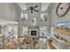 Grand living room featuring a fireplace, hardwood floors, and open access to the kitchen and dining area at 296 Shoreline Dr, Princeton, NC 27569