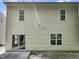 Back of home features sliding glass doors and plenty of windows for natural light at 3223 Polite Ln, Raleigh, NC 27610