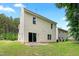 Backyard with grass, patio, and siding at 3223 Polite Ln, Raleigh, NC 27610