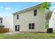 The home's backyard features a sliding door entrance and an air conditioning unit at 3223 Polite Ln, Raleigh, NC 27610