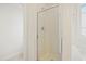 Bathroom features a shower with glass door and chrome hardware, and a white soaking tub at 3223 Polite Ln, Raleigh, NC 27610