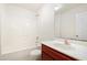 Neat bathroom featuring a shower and tub combination, vanity, and white tiled walls at 3223 Polite Ln, Raleigh, NC 27610