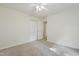 Bedroom with neutral carpet and a closet featuring doors that open into another room at 3223 Polite Ln, Raleigh, NC 27610