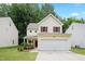 Charming two-story home featuring a 2-car garage and a landscaped front yard at 3223 Polite Ln, Raleigh, NC 27610