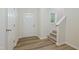 Bright entryway with hardwood floors, a stairway, a coat closet and decorative door glass at 3223 Polite Ln, Raleigh, NC 27610