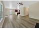 Bright, spacious living room featuring hardwood floors, access to the kitchen, and sliding door at 3223 Polite Ln, Raleigh, NC 27610