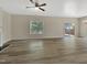 Bright, spacious living room featuring hardwood floors, fireplace, and sliding door at 3223 Polite Ln, Raleigh, NC 27610