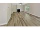 Large living room with hardwood flooring, a fireplace, neutral paint, and lots of natural light at 3223 Polite Ln, Raleigh, NC 27610
