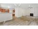 Open floor plan showcases seamless living space with kitchen and fireplace at 3223 Polite Ln, Raleigh, NC 27610