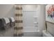 Bright bathroom featuring a combination shower and tub, with decorative shower curtain at 3608 Sorda Ct, Raleigh, NC 27610