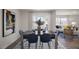 Elegant dining room with a modern table, stylish chairs, and plenty of natural light streaming in from a slider at 3608 Sorda Ct, Raleigh, NC 27610