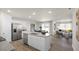 Open-concept kitchen with granite countertops, a kitchen island with seating, and stainless steel appliances at 3608 Sorda Ct, Raleigh, NC 27610