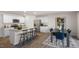 Spacious open-concept kitchen with granite countertops, stainless steel appliances, and a dining area at 3608 Sorda Ct, Raleigh, NC 27610
