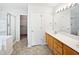Spacious bathroom with dual vanity, a glass-enclosed shower, and walk-in closet at 3705 Cassaro Ln, Zebulon, NC 27597