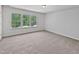 Bedroom with carpet and natural light streaming through the windows at 3705 Cassaro Ln, Zebulon, NC 27597