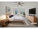 This main bedroom offers natural light, neutral tones, and comfortable furnishings at 3705 Cassaro Ln, Zebulon, NC 27597
