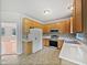 Well-lit kitchen with ample cabinet space, stainless steel appliances, and a tiled backsplash at 3705 Cassaro Ln, Zebulon, NC 27597