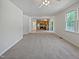 Open-concept living room flows into the kitchen with hardwood cabinets at 3705 Cassaro Ln, Zebulon, NC 27597