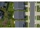 Aerial view of rooftops and verdant lawns, showcasing property's setting within a well-maintained neighborhood at 4024 Dunkirk Dr, Burlington, NC 27215