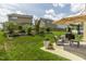 Lush backyard features a well-manicured lawn and a cozy patio seating area, perfect for outdoor enjoyment at 4024 Dunkirk Dr, Burlington, NC 27215