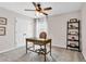 Cozy bedroom features a ceiling fan, neutral walls and carpet, perfect for a home office or study space at 4024 Dunkirk Dr, Burlington, NC 27215
