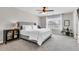 Spacious bedroom with a large bed, side tables, and natural light from the window at 4024 Dunkirk Dr, Burlington, NC 27215